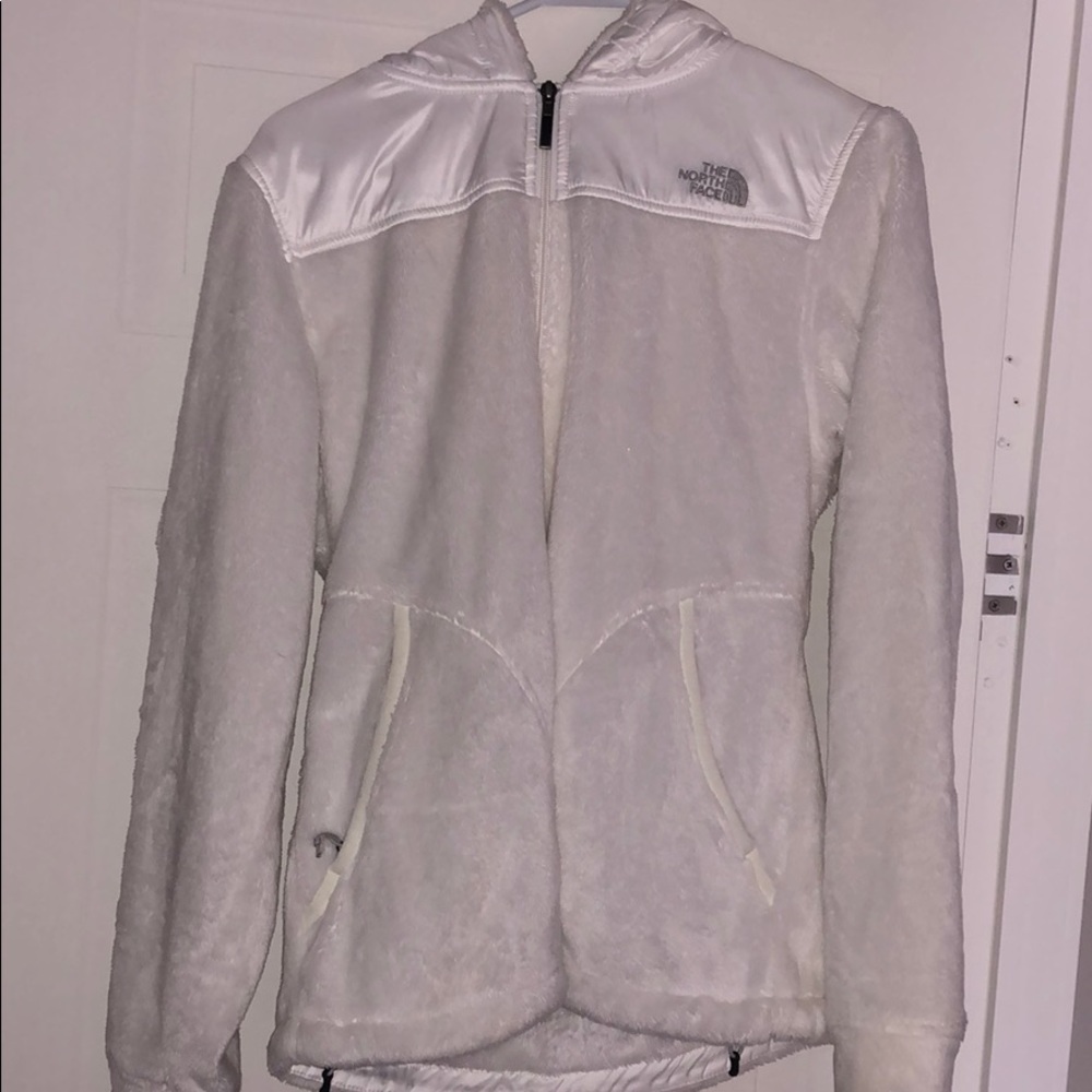 Women’s soft white North Face jacket.